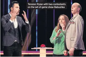  ??  ?? Tension: Rylan with two contestant­s on the set of game show Babushka