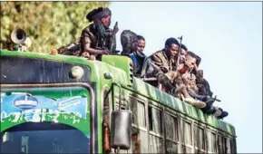  ?? AFP ?? Soldiers of the Ethiopian National Defence Force (ENDF) ride on a bus in Gashena. The military has been accused of burning a Tigrayan to death.
