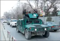  ?? MOHAMMAD ISMAIL / REUTERS ?? Afghan police officers arrive at the site of blasts and gunfire in Kabul on Wednesday.