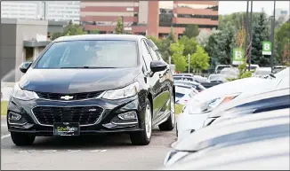  ?? (AP) ?? In this file photo, a used 2017 Chevrolet Cruze sits in a row of other used, late-model sedans at a dealership in Centennial, Colorado. A shortage of used vehicles in the US has pushed up prices, and that caused much of Sep
tember 2020’s modest inflation increase.