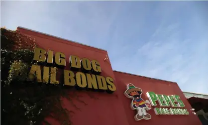  ??  ?? Bail bonds businesses outside the Los Angeles county men’s jail. Photograph: Lucy Nicholson/Reuters