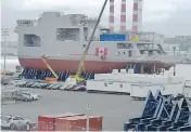  ?? ANDREW VAUGHAN / THE CANADIAN PRESS ?? HMCS Harry DeWolf, an Arctic patrol ship, sits in drydock at the Halifax Shipyard.