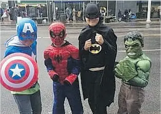  ?? KELTYN MARSHALL/ EDMONTON JOURNAL ?? Edmonton was well protected by this group of superheroe­s Friday: Aiden Corless, 7, Dominic Bilecki, 7, Daniel Bilecki, 9, and Lucas Corless, 5, at the K-Days parade.