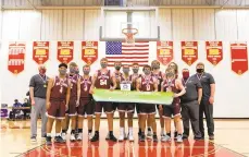  ?? RICH HUNDLEY III / SPECIAL TO THE MORNING CALL ?? The Bangor team poses together after winning Friday night’s Colonial League championsh­ip game with an 83-75 win over Notre Dame at Moravian Academy in Bethlehem Township.