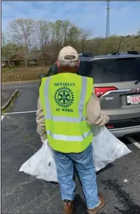  ?? Submitted photo ?? SERVICE: HSV Rotarian Clif Haygood participat­es in the Village Clean-up wearing his “Rotarian At Work” vest.