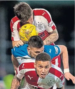  ?? Pictures: SNS. ?? Graham Cummins, top, in action for St Johnstone in their Europa League qualifer against FK Trakai in 2017; Cummins, above, is sandwiched by Rangers duo James Tavernier and Rob Kiernan.