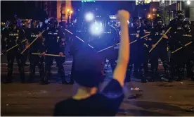  ??  ?? Police hold off protesters in Louisville, Kentucky, on 29 May. Photograph: Michael Clevenger/AP