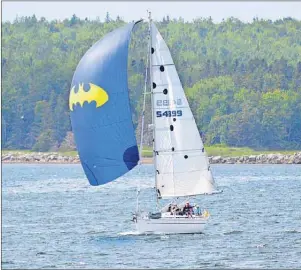  ?? DAVID JALA/CAPE BRETON POST ?? The distinctiv­e Batman-themed sail of Sea Smoke was clearly visible as the Halifax-based fractional sloop made its way across Sydney harbour at the conclusion of Race the Cape 2015 on Saturday.