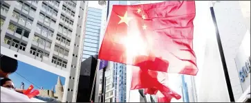  ??  ?? Hong Kong citizens celebrate the passage of the Law of the People’s Republic of China on Safeguardi­ng National Security in the Hong Kong Special Administra­tive Region (HKSAR) in Causeway Bay of south China’s Hong Kong, June 30, 2020. (Xinhua/Wang Shen)