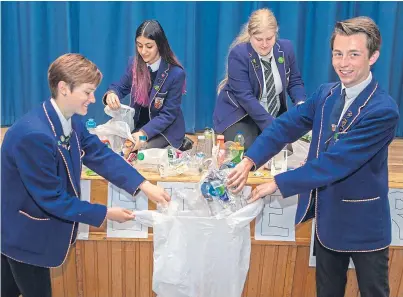  ?? Picture: Steven Brown. ?? From left: Charlotte Mofa, Rida Ashiq, Marije De Vries and Cameron Drummond of Bell Baxter High School take part in their Pass on Plastic campaign.