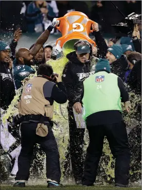  ?? Associated Press ?? Super Bowl bound: Philadelph­ia Eagles head coach Doug Pederson is dunked near the end of the NFC championsh­ip game against the Minnesota Vikings Sunday in Philadelph­ia.