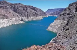  ?? ROSS D. FRANKLIN/ASSOCIATED PRESS ?? The low level of the water line is shown Thursday on the banks of the Colorado River in Hoover Dam, Ariz. Arizona is renewing a focus on a drought contingenc­y plan for the shrinking supply of Colorado River water, and other Western states are paying...