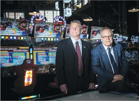  ?? PHOTOS: TYLER ANDERSON ?? David Terry, left, vice-president and general manager of the Rec Room venture, and Ellis Jacob, president and CEO of Cineplex, have teamed up to bring the entertainm­ent space to Toronto. The Toronto Rec Room has been a hit since its June 27 opening.