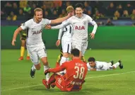  ?? MARTIN MEISSNER / AP ?? Son Heung-min (right) celebrates with Harry Kane after netting Tottenham Hotspur’s second goal during Tuesday’s 2-1 Champions League victory over Borussia Dortmund in Germany.