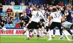  ??  ?? HERE WE GO: Lee Gregory scores Millwall’s first goal