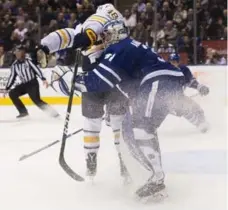  ?? NATHAN DENETTE/THE CANADIAN PRESS ?? Leafs netminder Frederik Andersen had a run-in with Sabres winger William Carrier early in Tuesday night’s game. No penalty on the play.