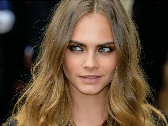  ?? (AFP/Getty) ?? Model and actor Cara Delevingne is 28 today
