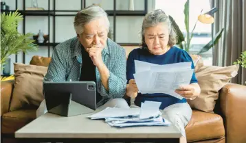  ?? GETTY ?? From taking on side work to strategica­lly downsizing, here are ways to help you tackle retirement debt.