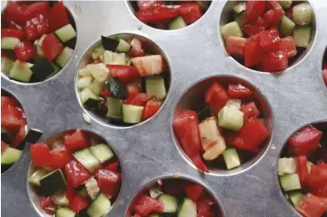  ??  ?? Frozen tomato-and-cucumber cups offer hydration during a hot summer day.