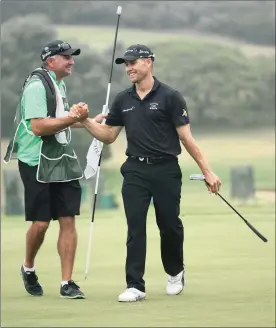  ?? Picture: WARREN LITTLE, GALLO IMAGES ?? YOU’RE THE BOSS: Trevor Fisher of South Africa celebrates victory with his caddie on the 18th green at the Africa Open in East London yesterday.