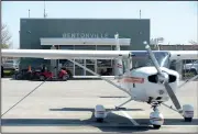  ?? NWA Democrat-Gazette/BEN GOFF • @NWABENGOFF ?? A plane used by Summit Aviation sits in front of the Summit Aviation office Monday at Bentonvill­e’s airport. Plans for a new flight center and museum on the northwest side of the runway, which will become the main entrance to the airport, include space...