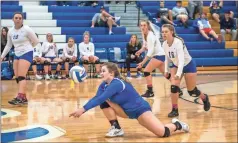  ?? Couey, Ringgold Tiger Shots / Courtney ?? Ringgold libero Emily Ridley goes low to dig up a shot during the Lady Tigers’ state playoff match against Lumpkin County on Saturday. Ringgold won the first set, but lost the next three and saw its season come to a close.