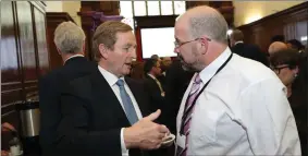  ??  ?? Taoiseach Enda Kenny in discussion with Finbarr Filan about the impact of Brexit.