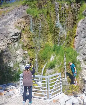  ?? J.P. SQUIRE/Special to The Daily Courier ?? When spring and summer days grow hotter, the cool shower cascading down Ribblewort­h Falls is an ideal location for wetting down your face and hair, above. The falls are located along the Okanagan Rail Trail on the east side of Wood Lake in Lake Country. It’s an ideal break spot with shade and benches.