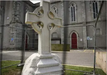  ??  ?? The Celtic Cross reinstated outside St Patrick’s Church.