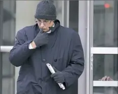  ?? Seth Wenig / Associated Press ?? Former Peru soccer official Manuel Burga makes the sign of the cross as he leaves federal court Tuesday in the Brooklyn, New York. “God Bless America. That’s all I can say,” Burga said after his acquittal verdict was returned in the FIFA bribery scandal.