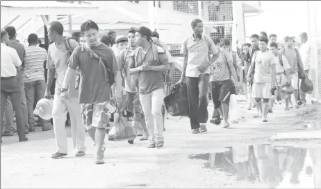  ?? (Photo by Keno George) ?? Those accused of conducting illegal mining operations in the Kaieteur National Park leaving the Criminal Investigat­ion Department yesterday afternoon after being released. The group, which consisted of 21 persons, including two women and a baby, was...