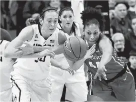  ?? Cloe Poisson / McClatchy-Tribune ?? Connecticu­t’s Breanna Stewart (left) steals the ball from Rutgers’ Betnijah Laney in the first half of the Huskies’ 72-35 victory.