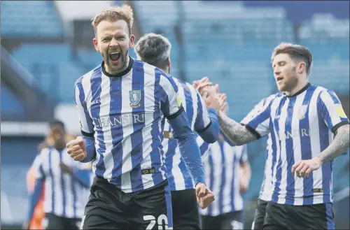  ?? PICTURE: ISAAC PARKIN/PA ?? LIFELINE: Sheffield Wednesday striker Jordan Rhodes celebrates his seventh goal of the season as the Owls ran riot against Cardiff City at Hillsborou­gh.