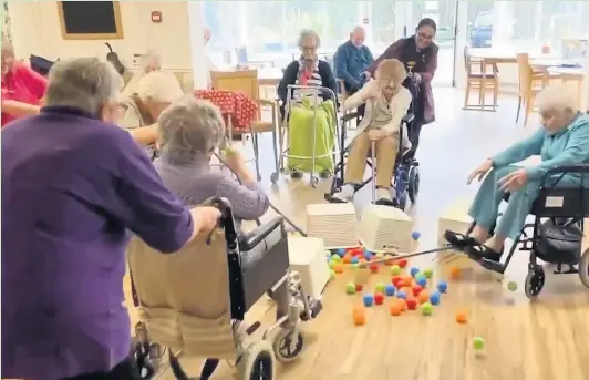  ?? BRYN CELYN CARE HOME ?? Residents play Hungry Hippos at Bryn Celyn Care Home in Maesteg