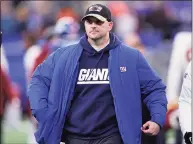  ?? Adam Hunger / Associated Press ?? New York Giants coach Joe Judge walks off the field after a loss to the Washington Football Team on Sunday in East Rutherford, N.J. The Giants fired Judge on Tuesday, after he went 10-23 in two seasons.