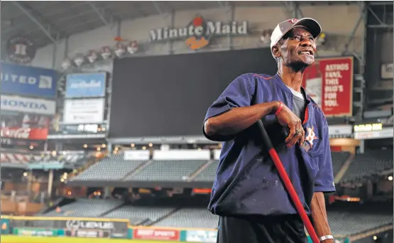  ?? Karen Warren / Houston Chronicle ?? Astros groundskee­per Willie Berry takes a brief break to look back on 46 years of service at Minute Maid Park and before that the Astrodome.