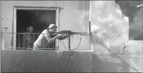  ?? AP/Hawar News Agency ?? This frame grab from video released Thursday and provided by Hawar News Agency, a Syrian Kurdish activist-run media group, shows a fighter from the U.S.-backed Syrian Democratic Forces firing his weapon during clashes with Islamic State group fighters...