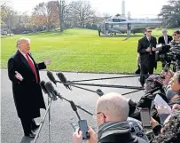  ?? Picture: Getty. ?? Mr Trump answers questions from the press while departing the White House.