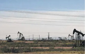  ?? JERI CLAUSING/AP ?? Oil rigs in the Loco Hills field along U.S. Highway 82 in Eddy County, near Artesia, N.M., one of the most active regions of the Permian Basin.