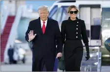  ?? MANUEL BALCE CENETA — THE ASSOCIATED PRESS ?? President Donald Trump and first lady Melania Trump arrive on Marine One before boarding Air Force One at Andrews Air Force Base, Md., on their White House departure Wednesday.