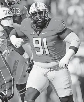  ?? [PHOTO BY NATE BILLINGS, THE OKLAHOMAN] ?? Former Oklahoma State defensive lineman DeQuinton Osborne is thankful for what his mother, Dorothy, went through to raise him.