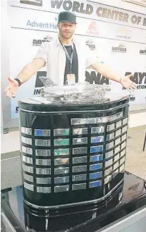  ?? STEPHEN M. DOWELL/ORLANDO SENTINEL ?? Patriots receiver Julian Edelman, Sunday’s honorary starter, stands with the Daytona 500 trophy before the race. “It’s still pretty surreal,” he says of all that’s happened the past month.