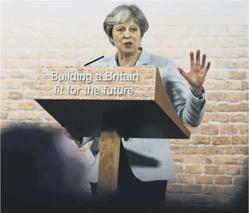  ??  ?? 0 Theresa May delivers a speech in central London yesterday. She says she cannot accept the EU’S fall-back plan for the Irish border