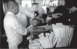  ?? Justin Sullivan Getty Images ?? PAPER straws at Fog Harbor Fish House in San Francisco. A new city law bars restaurant­s from offering patrons plastic utensils or disposable food accessorie­s.