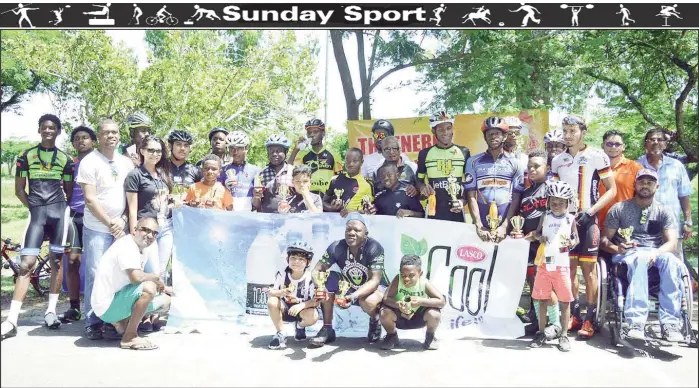  ??  ?? Ansa McAl officials, race organizers and officials along with racers pose for a photo at the end of the event.