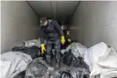  ?? ?? Morgue employees inside a truck storing bodies. Photograph: Alessio Mamo/The Guardian