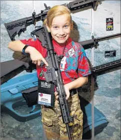  ?? Jay L. Clendenin Los Angeles Times ?? ADDYSSON “ADDY” SOLTAU, shown at the NRA convention on Saturday, started shooting three years ago. Her parents weren’t into guns.