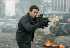  ?? STXFILMS VIA AP ?? This cover image released by STXfilms shows Mark Wahlberg in a scene from “Mile 22.”