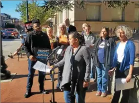  ?? BILL RETTEW JR. – DIGITAL FIRST MEDIA ?? Democratic activist Lisa Longo addresses fellow demonstrat­ors during Friday’s rally and press conference at Rep. Ryan Costello’s West Chester office.