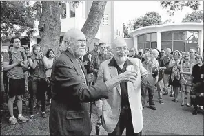  ?? AP/JAE C. HONG ?? Barry Barish (front left) and Kip Thorne, scientists at the California Institute of Technology, celebrate with students Tuesday in Pasadena, Calif., after learning that they had won the Nobel Prize in physics.